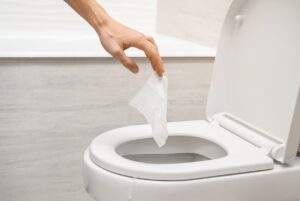 Wipe being flushed down toilet