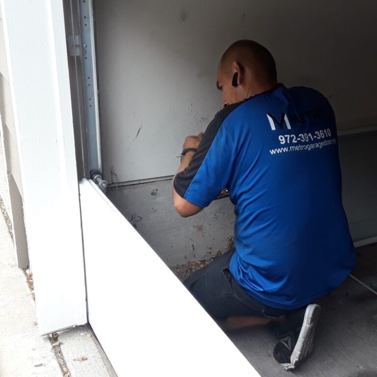 garage door technication replacing a door near dallas tx 768x768